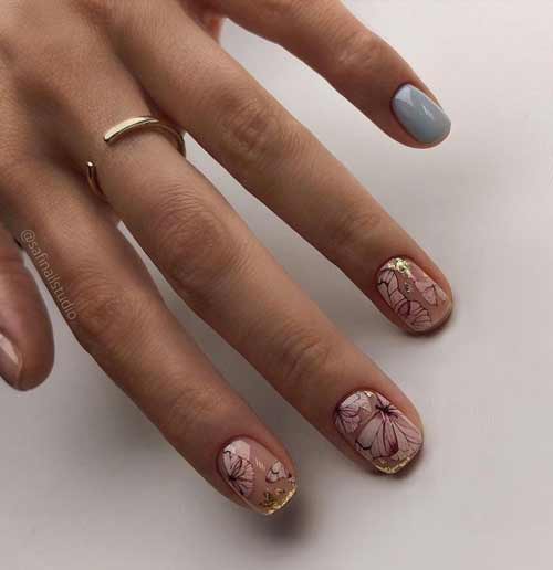 Belle manucure avec du papier d'aluminium et des papillons