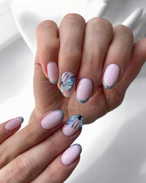 Veste argentée avec papillons