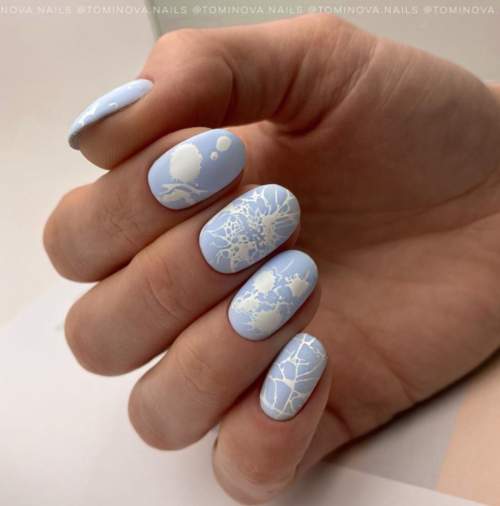 Manucure bleue du Nouvel An: nouveautés 2022, photos, idées de design