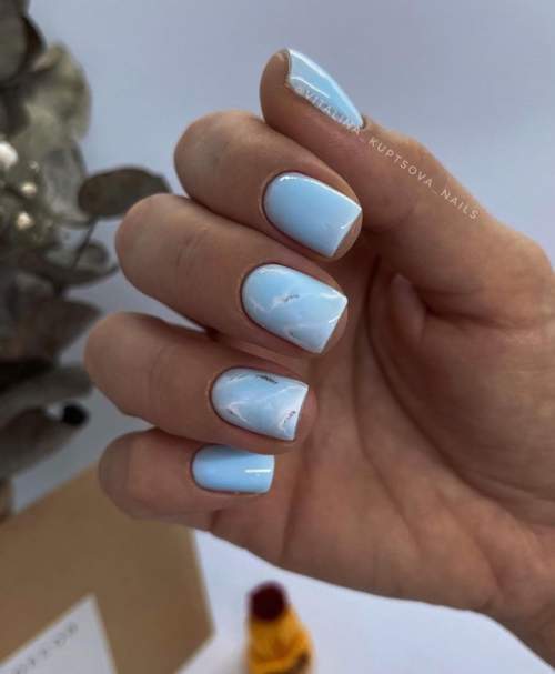 Manucure bleue du Nouvel An: nouveautés 2022, photos, idées de design