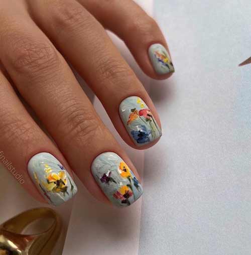 Fleurs en technique de trait sur les ongles