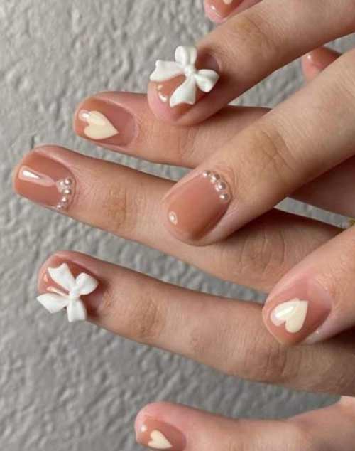 Arc et coeur sur les ongles